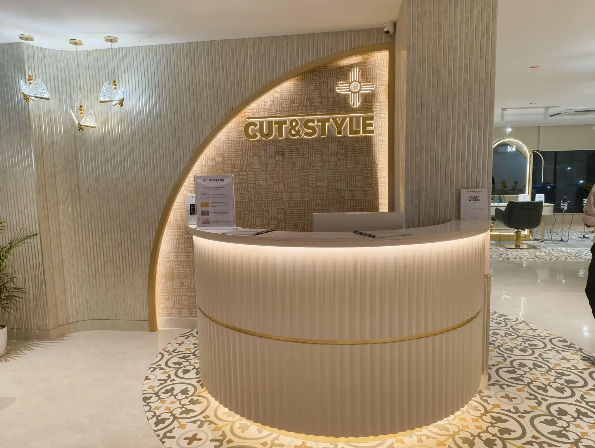 CUT & STYLE branded reception with warm lighting